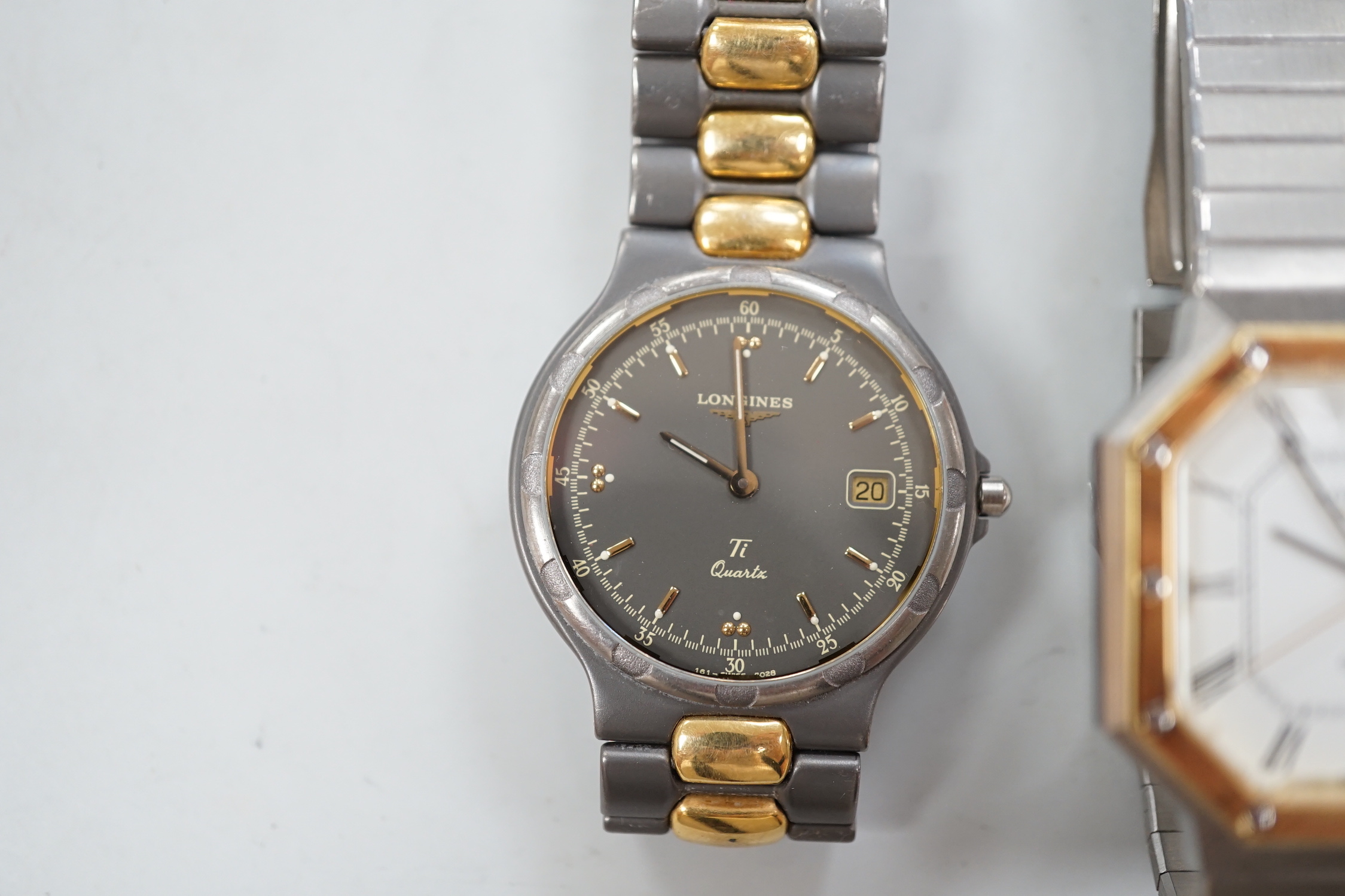 Two gentleman's steel and gold plated Longines quartz wrist watches, one with octagonal case.